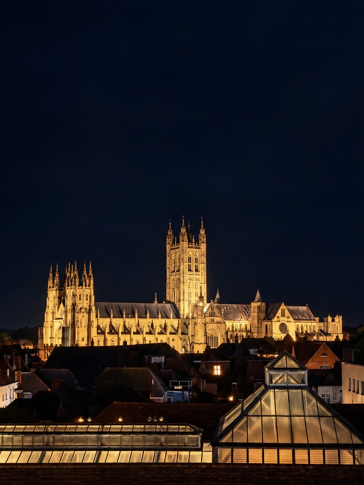 Canterbury Cathedral lit up at night, seen from The Rooftop